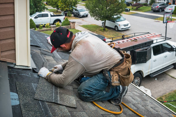 Professional Roofing technician working in Newton, MA